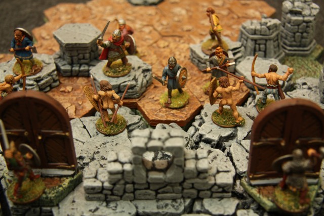 The warband charges and pushes back the barbarians
