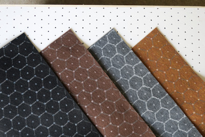 Several colors of felt with hex grids